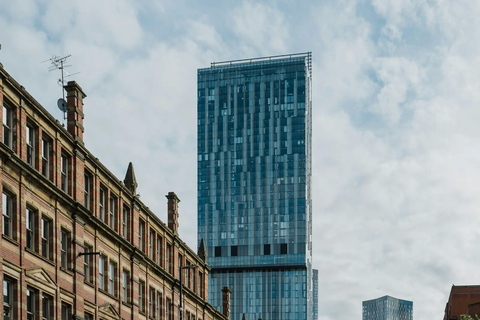 Manchester city centre with modern towers above a historic street