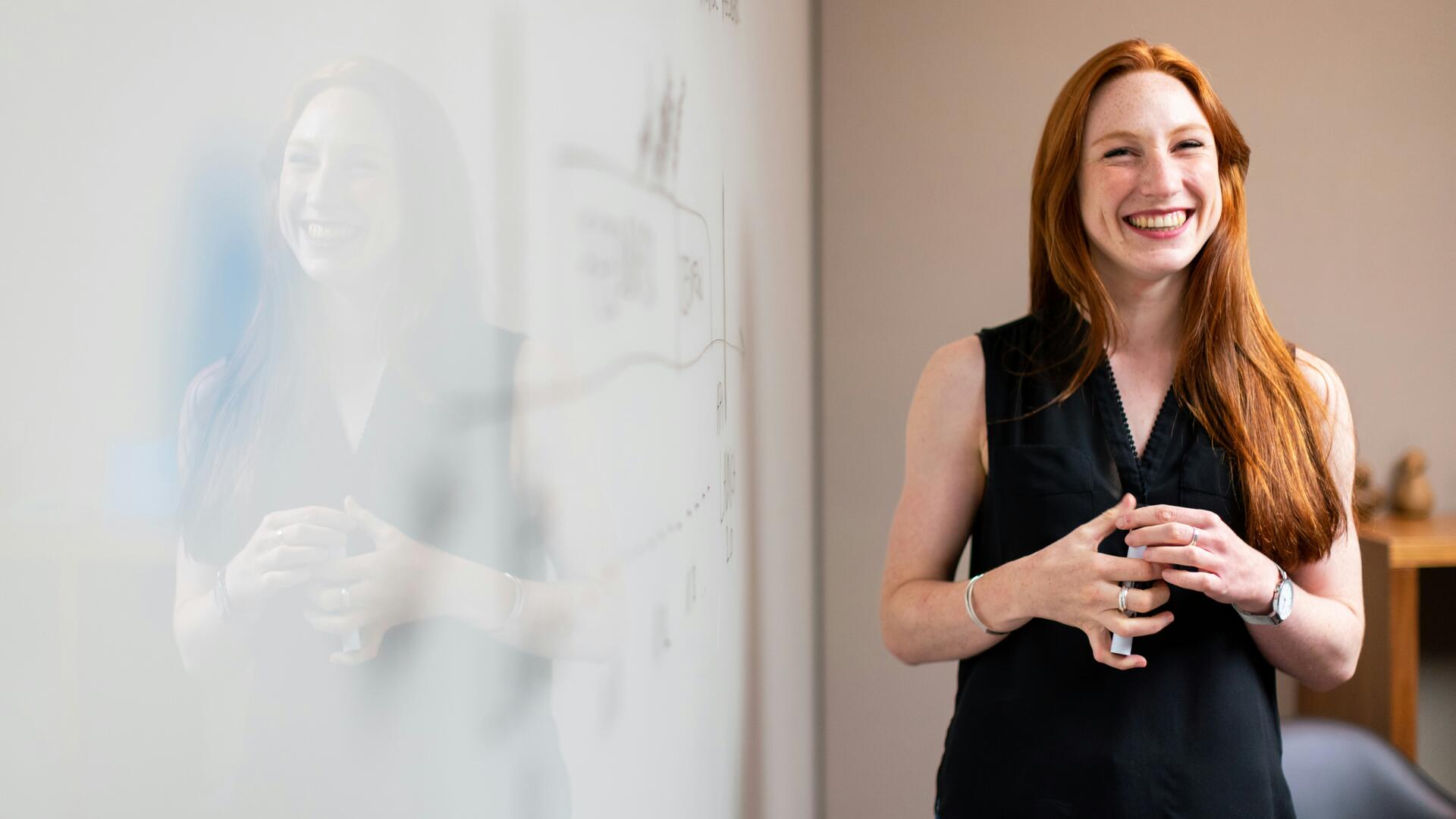 Professional woman presenting technical concepts