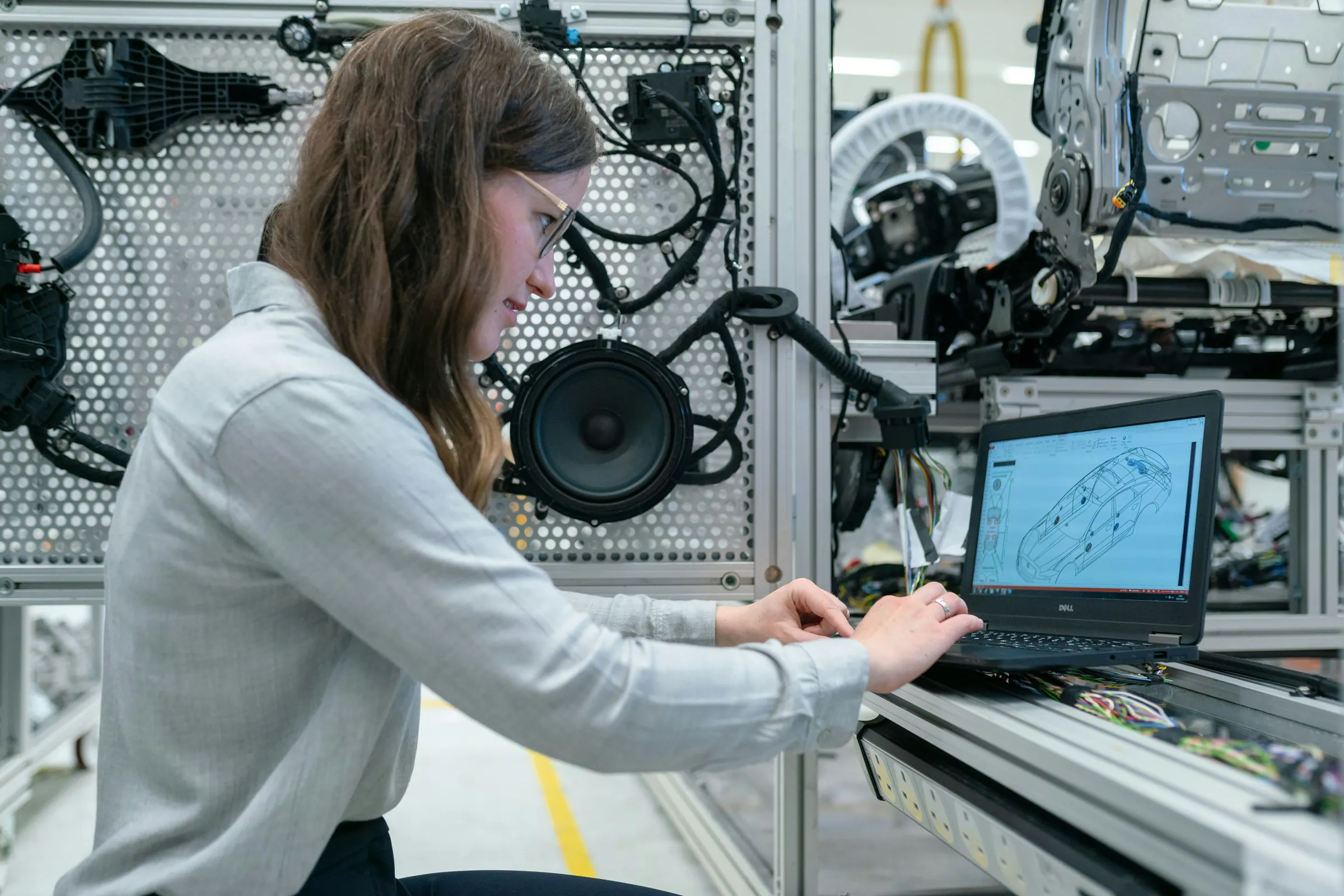 Manufacturing engineer working on an automotive electrical system