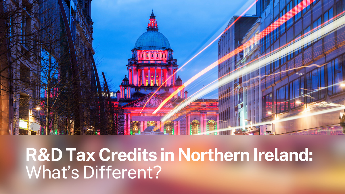 Belfast City Hall illuminated at dusk — representing the distinct Northern Ireland R&D Tax Relief framework under the ERIS scheme.