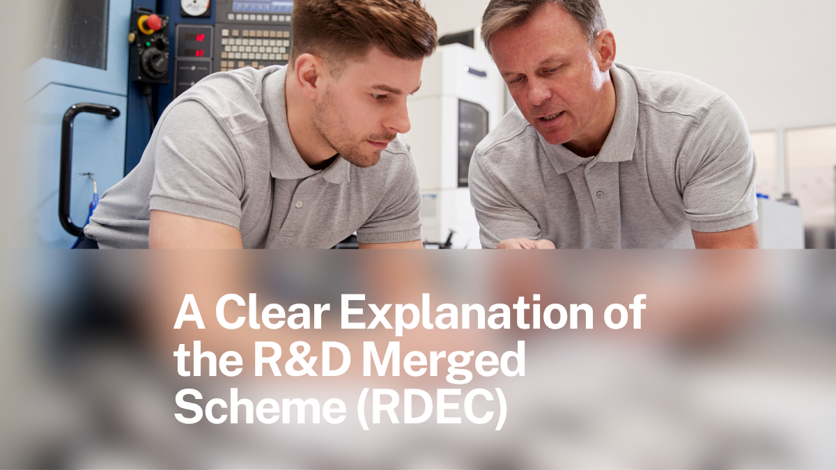 Two engineers discussing technical work in a manufacturing workshop — the kind of project that often qualifies for R&D Tax Relief under the merged RDEC scheme.